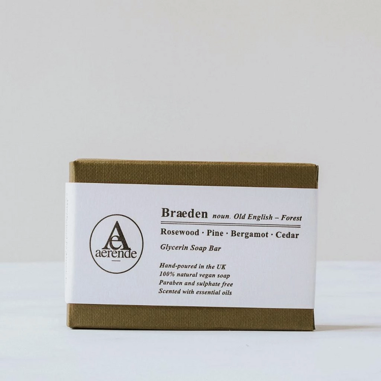 Soap in an olive green textured box with white belly band