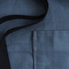 denim apron pocket closeup